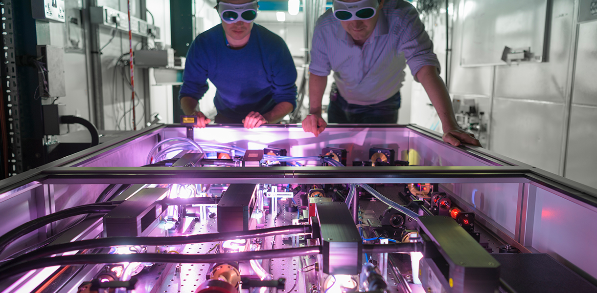 SP-Papers_0007_TOKAMAK-SCIENCE Two employees looking over Tokamak Science Equipment
